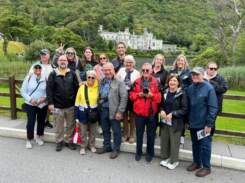 RJ Kost with community members during group outing, showing connection with people and community involvement